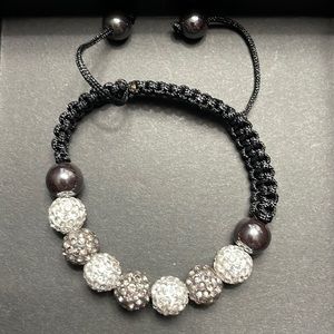 Bracelet rhinestone with nylon adjustable band.